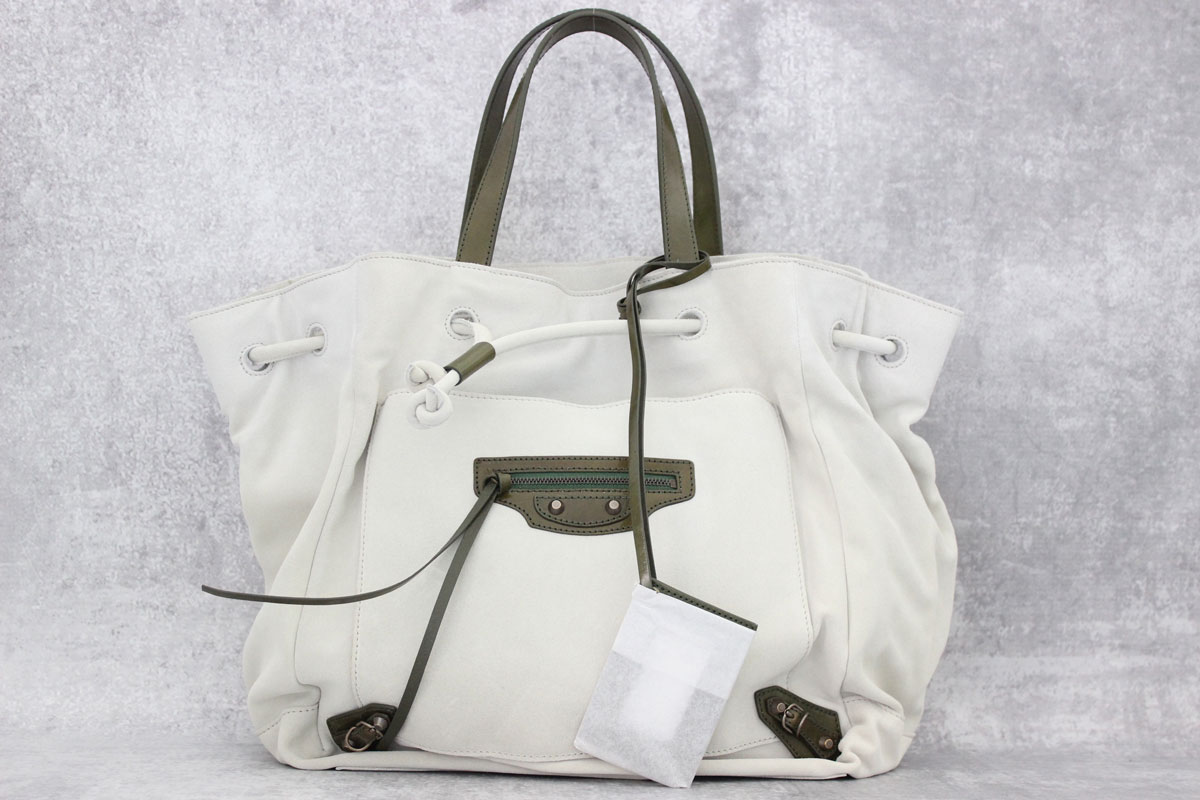 balenciaga beige suede drawstring bag at Jill's Consignment